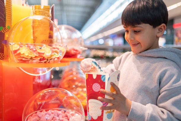 Boy Shopping For Candies In Candy Shop